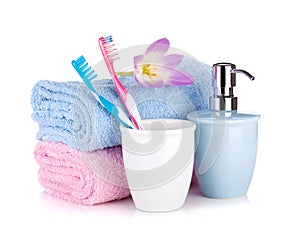 Toothbrushes, soap and two towels