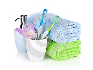 Toothbrushes, soap and two towels