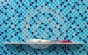 Toothbrushes and toothpaste on a shelf