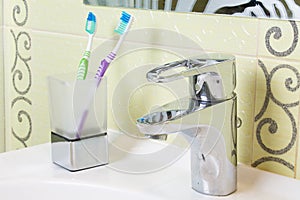 Toothbrushes on the washbasin