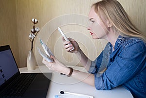 Toothpaste ingredients. Girl at laptop checks composition of toothpaste and is surprised by dangerous composition of product.