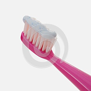 Toothpaste on pink toothbrush isolated on white background