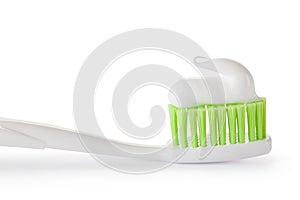 Toothpaste on the toothbrush. Closeup.