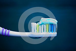 Toothbrush with toothpaste on a green background