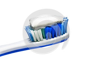 Toothpaste on the toothbrush isolated on white background