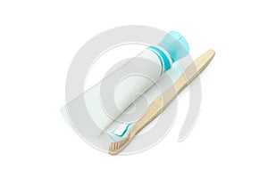 Toothpaste tube and toothbrush isolated on white background
