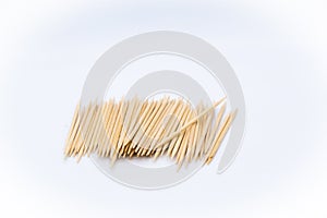 Toothpicks in the center of the image on white background photo