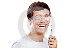 Toothy smile with brush closeup photo