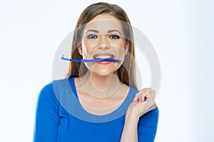 Toothy smiling beautiful woman with healthy teeth holding tooth