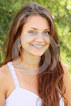 Toothy smiling brunette with green eyes