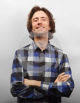 Toothy smiling caucasian man in causal shirt isolated