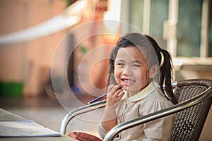 Toothy smiling face of adorable sian children at home happiness