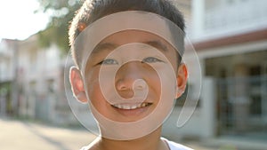 Toothy smiling face of asian children happiness emotion