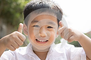 Toothy smiling face of asian children happiness emotion