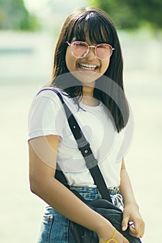 Toothy smiling face of asian teenager casual lifestyle