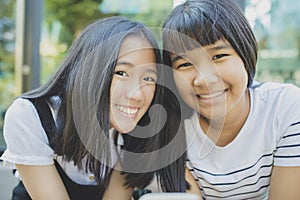 Toothy smiling face of asian teenager happiness emotion