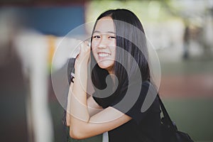 Toothy smiling face of asian teenager happiness emotion