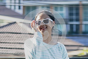 Toothy smiling face of asian teenager show braces teeth