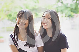 Toothy smiling face happiness emotion of two asian teenager