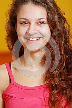 Toothy smiling girl in red