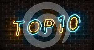 Top 10 neon blue and yellow light text on empty red brick wall banner. Bright sign of top ten list winners at night. Design templa