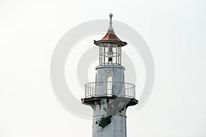 The top of abandoned 1800`s lighthouse at a sea shore
