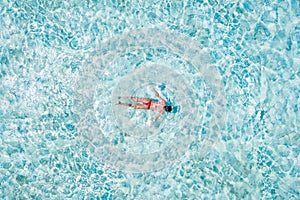 Top above high angle aerial drone view of her she girl diving pure blue clean clear ocean water pool enjoying joy relax