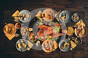 Top above high angle photo of big baked roast stuffed turkey salad decor middle of dinner thank god meal full plates