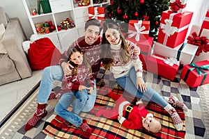 Top above high angle view full length photo of young family child parents happy positive smile decor eve time indoors