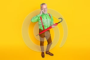 Top above high angle view full size photo of aged man happy positive smile wink eye hold parasol isolated over yellow