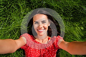 Top above high angle view of happy charming young woman make selfie lie glass weekend in park outdoors