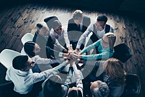 Top above high angle view of nice stylish sharks corporate company staff putting palms together over table desk