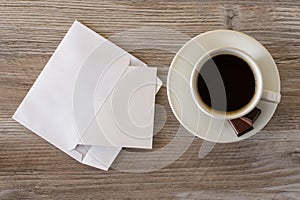 Top above overhead close up view photo of tasty fresh morning dark espresso cup of coffe with dessert sweet candies chocolate and