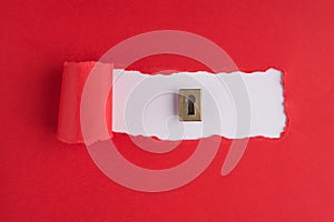 Top above overhead view photo of a keyhole on torn red paper over white background with copyspace