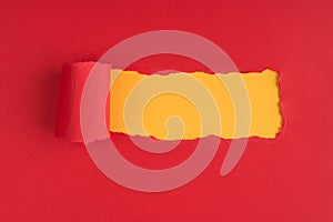 Top above overhead view photo of torn red paper over yellow background with copyspace