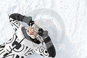 Top above view portrait young happy adult happy beautiful female skier woman enjoy have fun holding goggles in hand