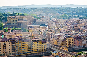 Top aerial panoramic view of Florence city, Ponte Vecchio bridge over Arno river, Palazzo Pitti palace