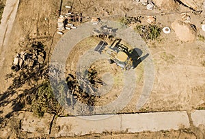 Top aerial view of big wheel loader excavator bulldozer work on a building project f