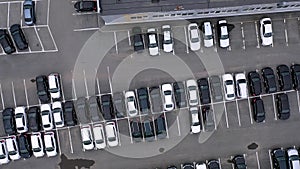 Top aerial view of many cars on parking lot or sale car dealer market.