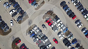 Top aerial view of many cars on a parking lot or sale car dealer market.