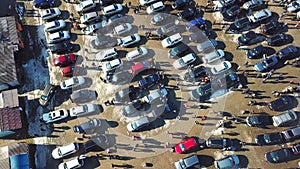 Top aerial view of many cars on sale car dealer market