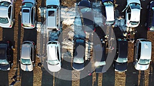 Top aerial view of many cars on sale car dealer market