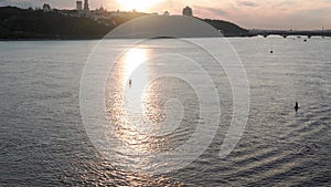 Top Aerial view moving fishing boat ocean. sailing motor boat with angler on Dnipro river at sunrise sunset. landscape