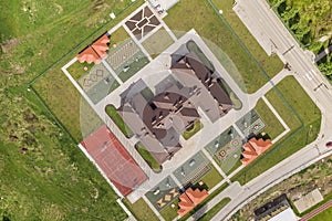 Top aerial view of new prescool building and yard with alcoves and green lawns