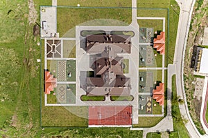 Top aerial view of new prescool building and yard with alcoves and green lawns photo
