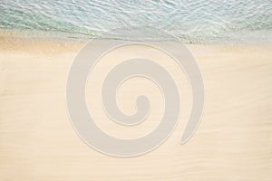 Top and aerial view on tropical sand beach with sea. Ocean coastline. Drone photo. Background.
