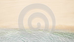 Top and aerial view on tropical sand beach with sea. Ocean coastline. Drone photo. Background. Panorama, 16:9.