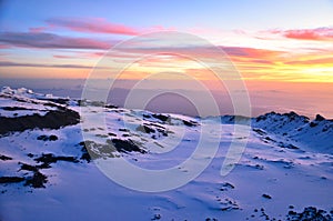 Top of Africa. Beautiful sunrise on Uhuru Peak Kilimanjaro in Tanzania. Adventure travel with trekking in Tanzania.