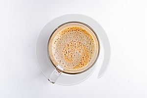 Top angle of milk tea or popularly known as The Tarik in Malaysia, isolated on the white background center of the frame