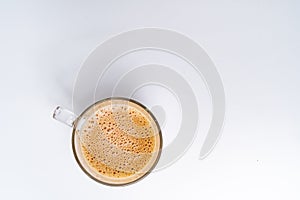 Top angle of milk tea or popularly known as The Tarik in Malaysia, isolated on the white background center of the frame